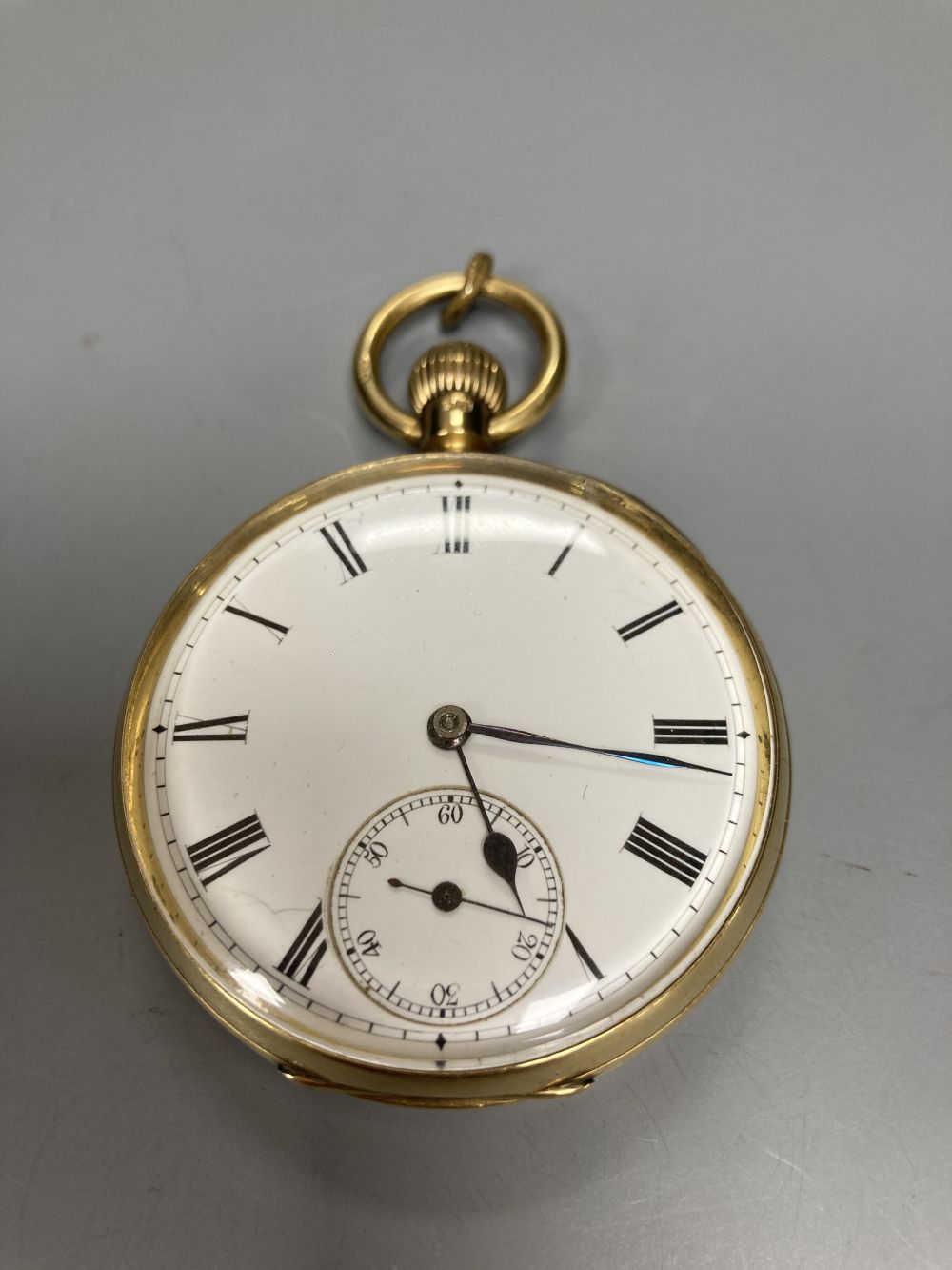 An Edwardian 18ct gold open face keywind lever pocket watch, the case back with engraved monogram,